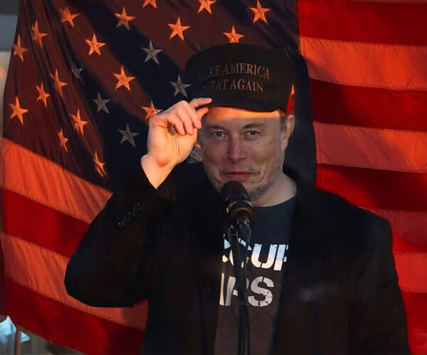 Dark MAGA Hat Elon Musk rallies onstage with Trump in Pennsylvania USA